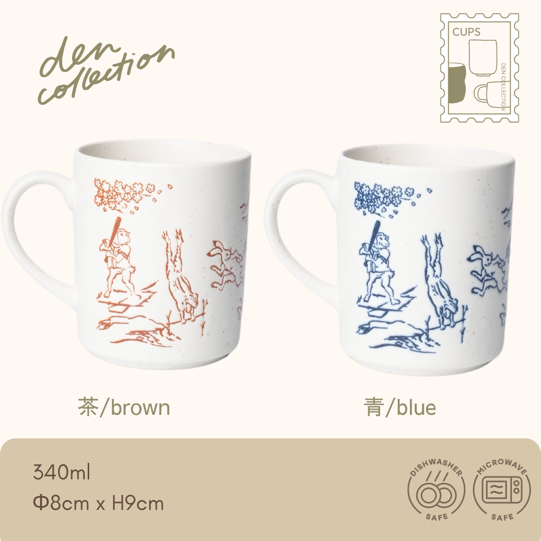 Choju-giga Mug – Japanese ceramic mugs featuring the famous “Scrolls of Frolicking Animals” in brown and blue. Traditional animal caricatures on speckled porcelain with handle. Dishwasher and microwave safe. / 鳥獣戯画のウサギやカエルなどが描かれた、日本の伝統的な磁器製マグカップ。茶と青の2色展開。食洗機・電子レンジ対応。