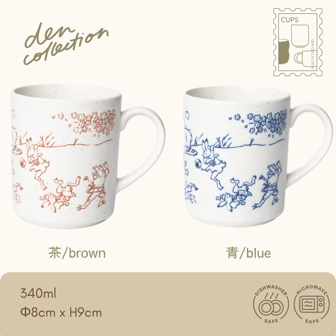 Choju-giga Mug – Japanese ceramic mugs featuring the famous “Scrolls of Frolicking Animals” in brown and blue. Traditional animal caricatures on speckled porcelain with handle. Dishwasher and microwave safe. / 鳥獣戯画のウサギやカエルなどが描かれた、日本の伝統的な磁器製マグカップ。茶と青の2色展開。食洗機・電子レンジ対応。